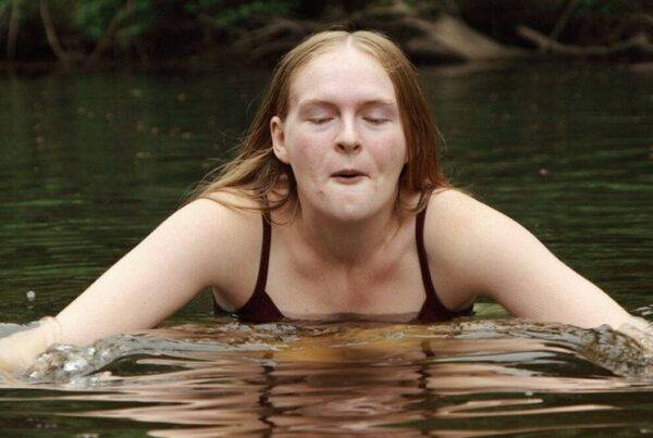 girl cold water swimming in a freshwater lake