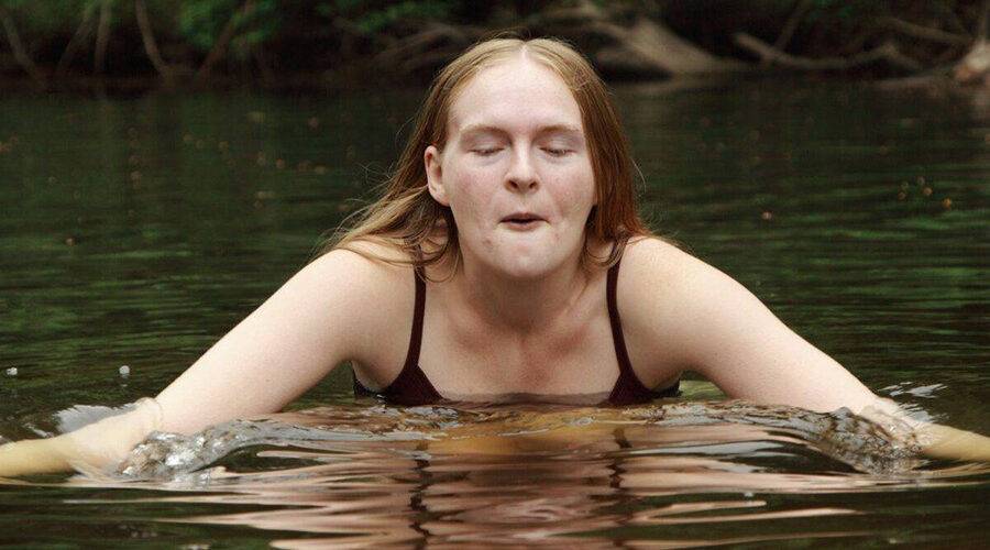 girl cold water swimming in a freshwater lake